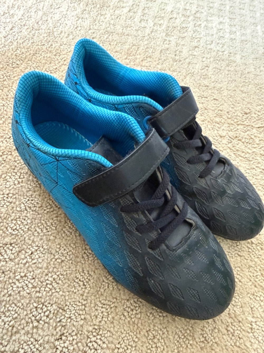 Youth Black and Bright Blue Athletic Cleats.